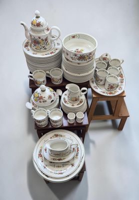 a table with a lot of dishes and cups on it