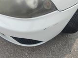 a close up of a car ' s front bumper