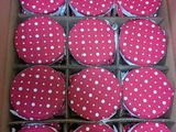 pink and white polka dot cupcakes in a box