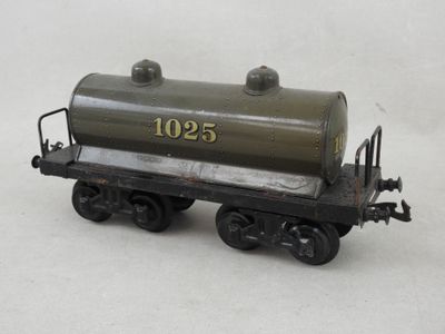 a toy train car with a tank on the side of it