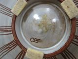 a brown and white plate with a brown design on it