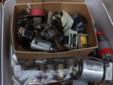 a cardboard box filled with assorted electrical components