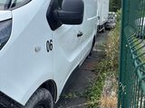 a white van that is parked on the side of the road