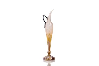 a glass vase with a black handle on a white background