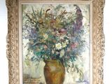 a painting of flowers in a vase on the wall