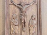 a statue of jesus on the cross on the wall
