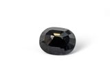 a close up of a black diamond on a white background