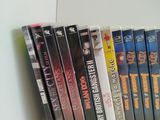 a lot of dvds on the shelf in the room