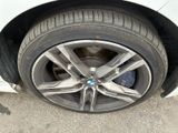 a close up of a tire on a white car