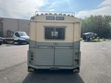 a trailer that is parked in a parking lot
