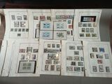 a lot of different stamps on a table together