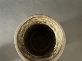 a metal pipe that is leaking out of the sink