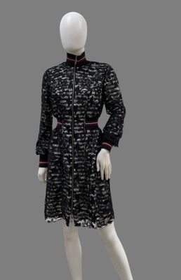 black and white dress with red trims on mannequin mannequin mannequin mannequin mannequin mannequin mannequin manne