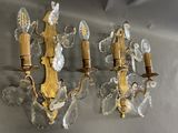 two wall sconces that are attached to the wall