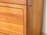 an image of a wooden chest of drawers on a hard wood floor