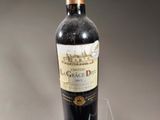 a bottle of wine that is sitting on a table