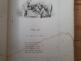 an open book with a picture of a man and a dog