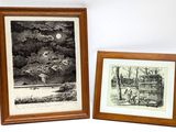 two framed prints of a boat and a house on a lake