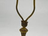 brass plated table lamp with a glass shade on the base