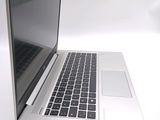 a close up of a laptop computer on a white surface