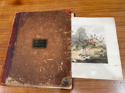 un vieux livre sur lequel figure l'image d'un chien