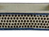 a blue and white planter with holes in it