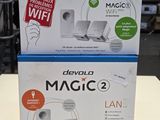 two boxes of devvoo magic 2 wifi routers on a table
