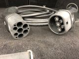 two wires that have been plugged into the back of a truck