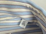 a close up of a blue and white striped shirt