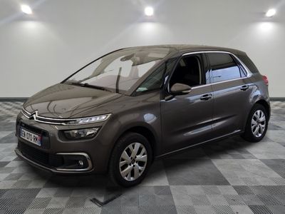the grey citrole is parked on a checkered floor