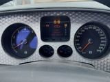 steering wheel of a car with gauges, gauges, and numbers on it
