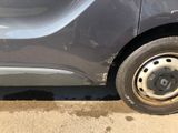 a car that has a flat tire on the side of the road