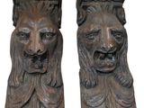 pair of carved wood lion head bookends