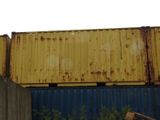 a yellow container sitting on top of a blue container