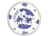 une assiette bleue et blanche avec une image d'un homme à cheval