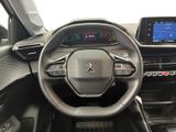 the interior of a car with a steering wheel, dashboard, and display screen