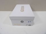 white box with gold lettering on it sitting on a white table
