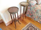 two tables that are sitting on a hard wood floor