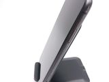 a cell phone that is sitting on top of a stand