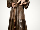 statue of st francis of assisi holding a baby