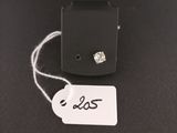 a close up of a tag on a black surface with a white tag attached to it