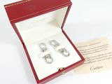 a red box with a pair of silver earrings in it