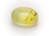 an oval shaped yellow quartz stone with a black stripe on it