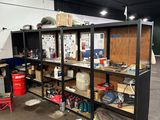 a garage with a lot of shelves and tools on it