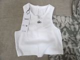 a white tank top with a black and white tie dye on it
