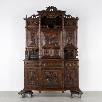 an old wooden china cabinet with ornate carvings on the top