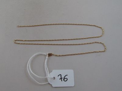 a close up of a tag on a chain with a tag attached to it