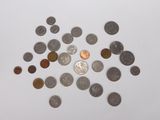 a lot of coins that are on the table