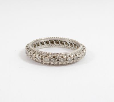 a close up of a silver ring on a white background