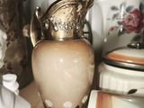 a vase that is sitting on a table next to other dishes